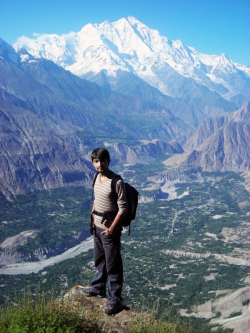 Imran Hunzai on Hon Pass Hunza Valley. Beautiful Rakaposhi can also bee seen in the background.
